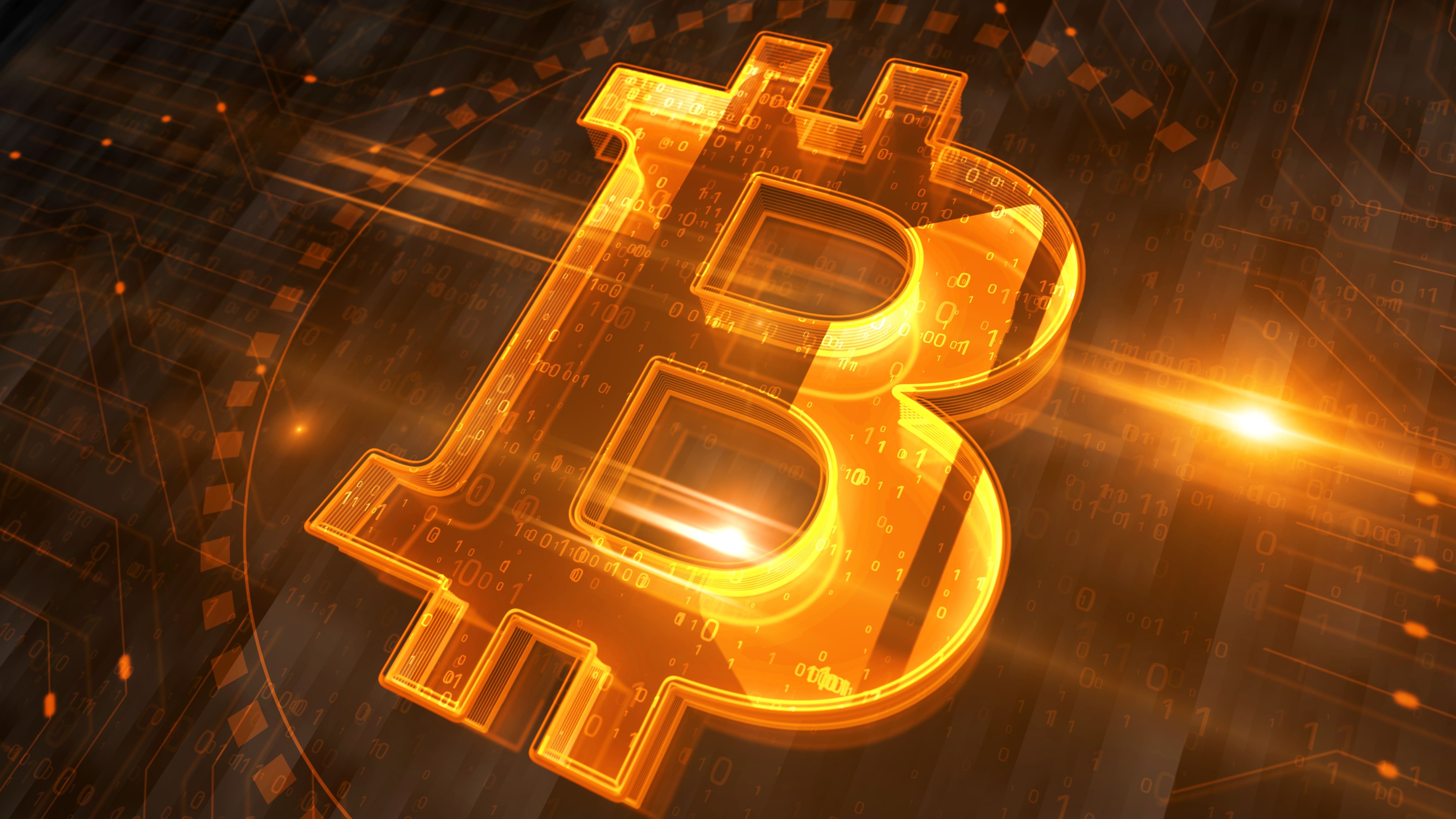 Bitcoin-Zeichen in der Mitte des Bildes.